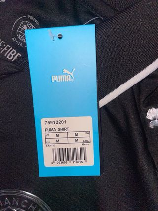 Camiseta Manchester City Talla M Negra y plata.