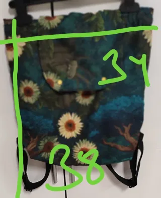 Mochila con solapa y cordón artesanal