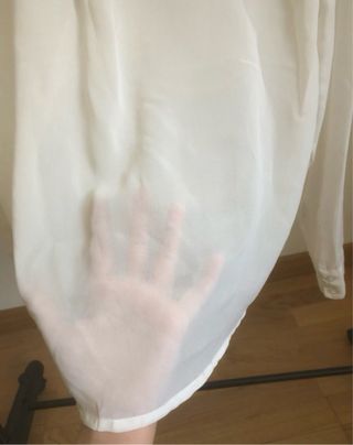 Blusa Calliope color panna con fiocco