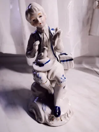 Figura porcelana niño con pájaros
