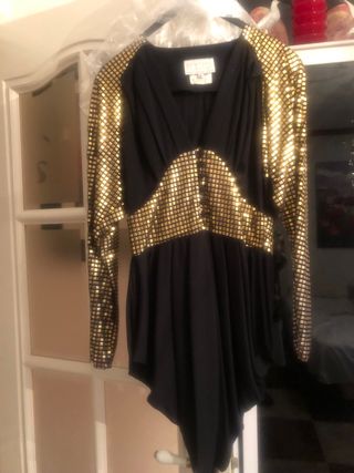 Blusón fiesta negro y oro,corte inglés