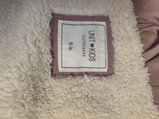 Chaqueta impermeable niña pelo