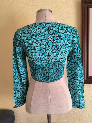 Top floral manga larga