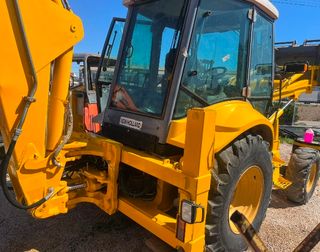 Retroexcavadora New Holland NH95 obra construccion