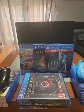 PS4 Slim 1TB + 2Mandos+ Juegos+Cables.