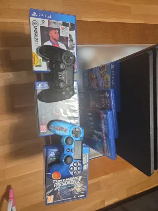PS4 Slim 1TB + 2Mandos+ Juegos+Cables.
