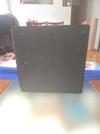 PS4 Slim 1TB + 2Mandos+ Juegos+Cables.