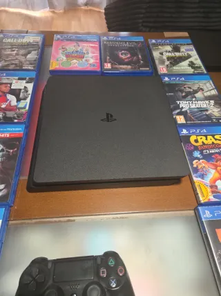 PS4 Slim 1TB + 2Mandos+ Juegos+Cables.