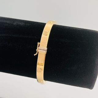 PULSERA RIGIDA TORNILLO ORO AMARILLO. Hueca. 18K.