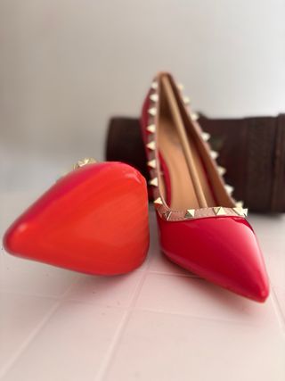 Décolleté rosse con borchie tacco 12 cm