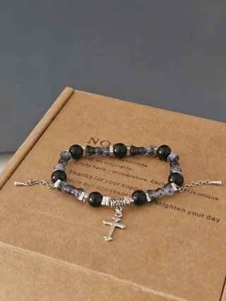 Pulsera con colgante de cruz