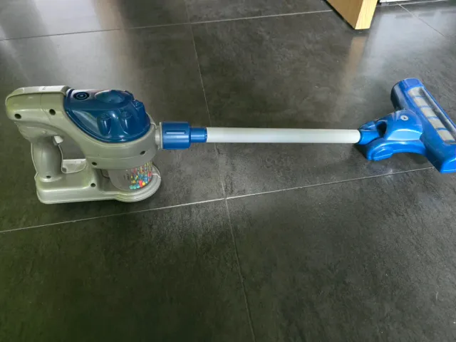 Aspirador de juguete con accesorios
