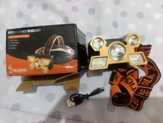 Linterna Frontal LED Dorada con Cinta Naranja