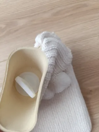 Bolsa de agua caliente con funda de tejido