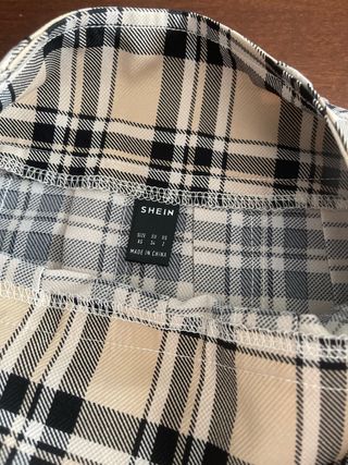 Minifalda de tablas cuadros beige y negro