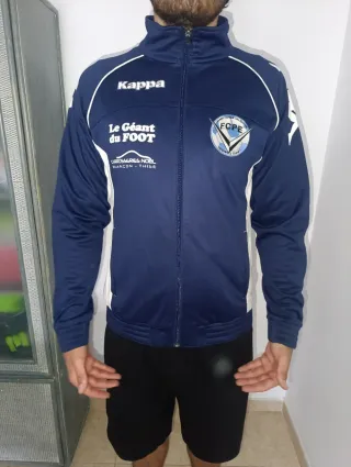 Chaqueta deportiva Kappa azul y blanca
