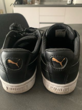 Scarpe Puma nere con dettagli oro