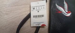 Bolso de mano negro con bordados