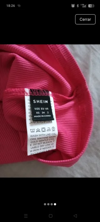 Top rosa cuello alto sin mangas