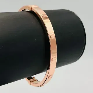 PULSERA RIGIDA TORNILLO ORO ROSA. Hueca. Oro 18k.