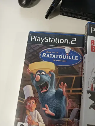 Play 2 con dos mandos volante y 3 juegos