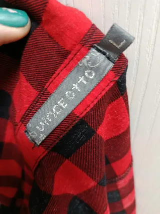 Camisa cuadros mujer sin mangas, es una L pequeña.