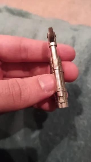 Pieza de mechero antiguo