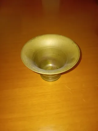 Mortero y mano de bronce