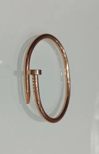 Bracciale rigido modello Cartier in acciaio dorato