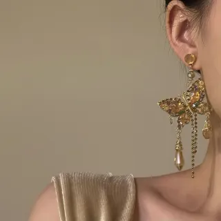 Pendientes vintage mariposa dorados flecos