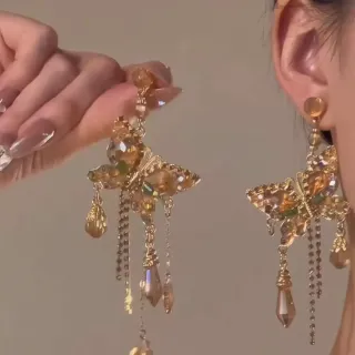 Pendientes vintage mariposa dorados flecos