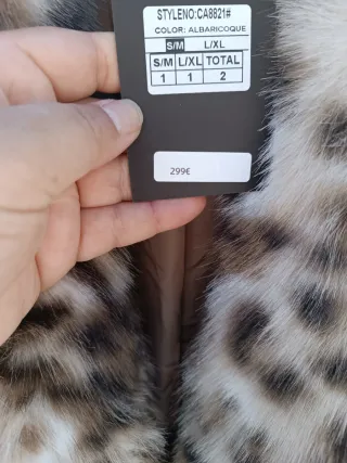 Cappotti in pelo marrone e nero, taglie dalla S alla XXL