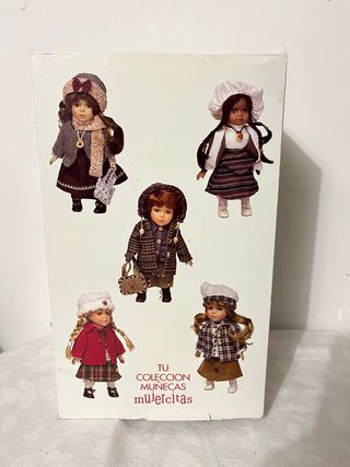 Muñeca de porcelana con maleta