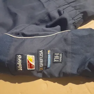 Chaqueta de moto azul con logos