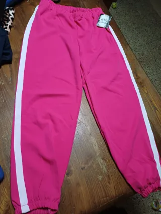 Pantaloni tuta rosa con banda laterale