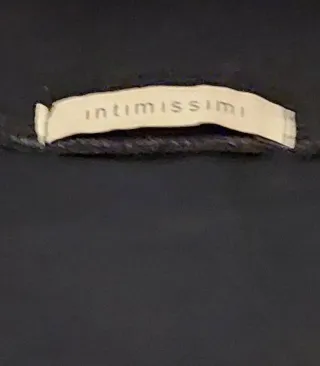 Vestito nero corto con balza