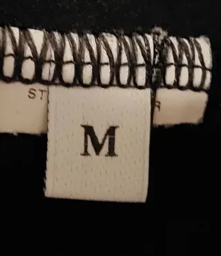 Vestito nero corto con balza