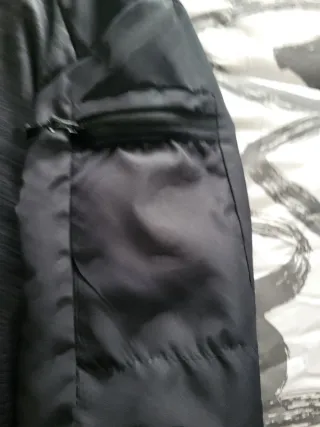 Chaqueta deportiva Decathlon gris y negra