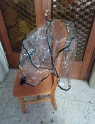 Protector de lluvia para silla de carro de bebé.