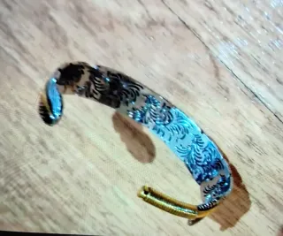 Pulsera diseño pluma oro y plata