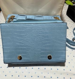 Bolso azul tejido efecto piel