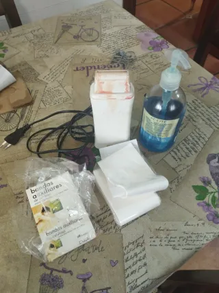 Máquina de cera tibia y bandas depilatorias