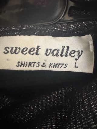 Jersey gris brillo cuello alto