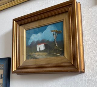 Quadro decorativo con cornice dorata