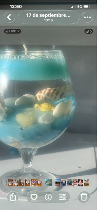 Vela decorativa de agua con conchas