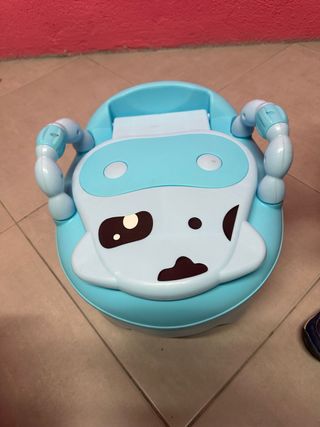 Orinal infantil azul con diseño de vaca