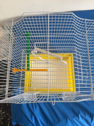 Jaula para pájaros blanca y amarilla