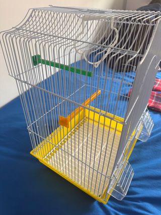 Jaula para pájaros blanca y amarilla