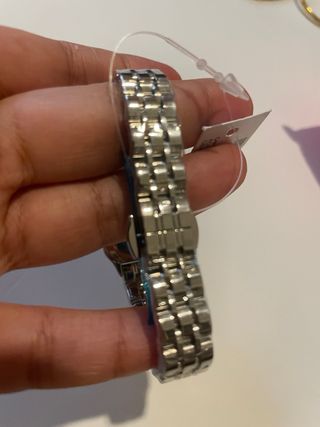 Reloj C**tier, plateado con diamantes