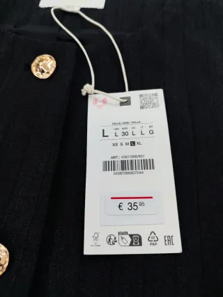 Chaleco Zara gris con rayas negras